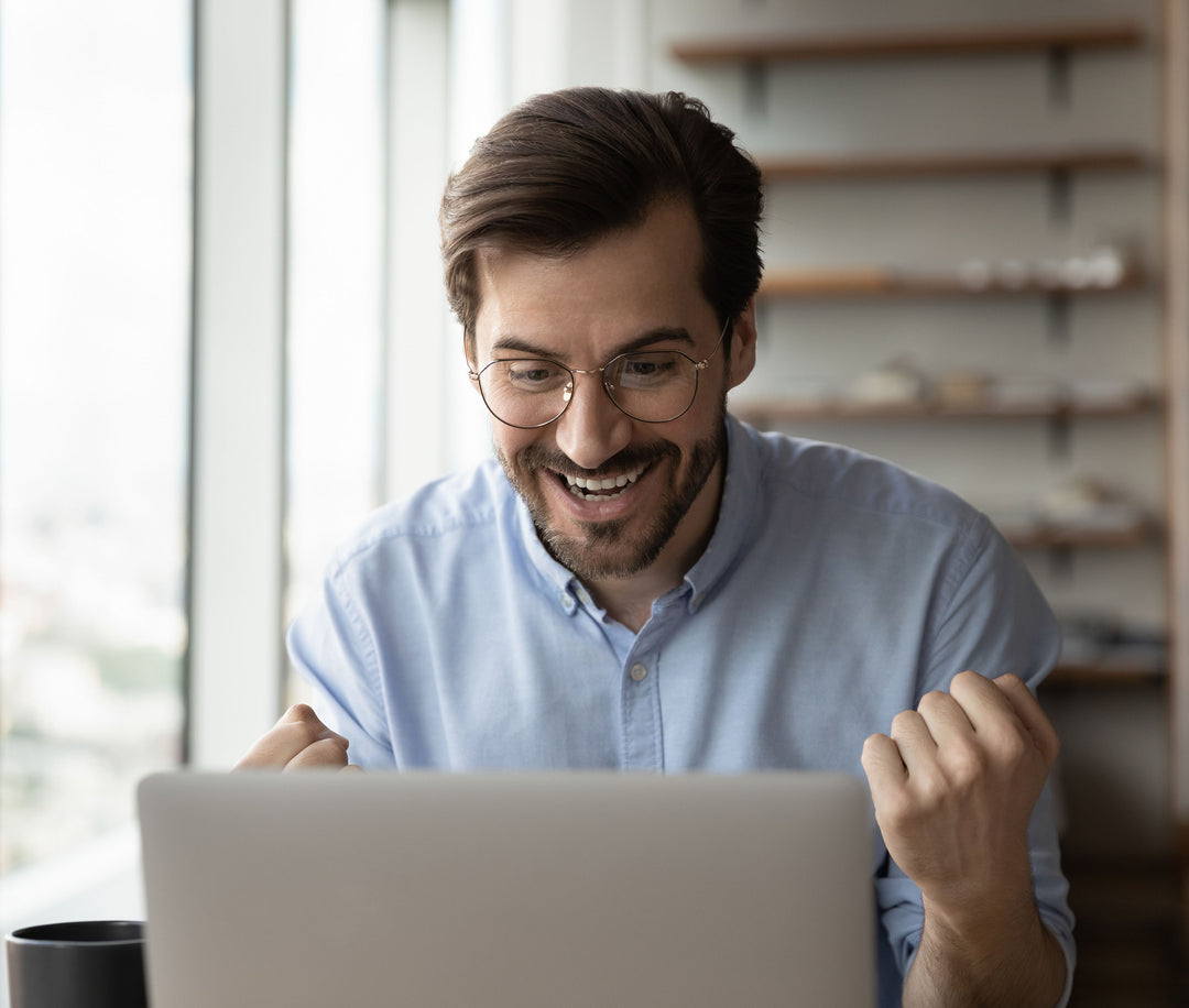 Happy man at computer