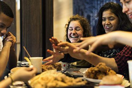 photo of a group of teens pigging out on junk food